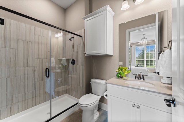 bathroom featuring walk in shower, vanity, and toilet