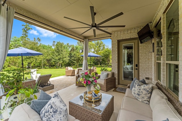 view of patio featuring ceiling fan and an outdoor hangout area