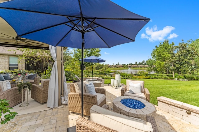 view of patio / terrace with an outdoor hangout area and a water view