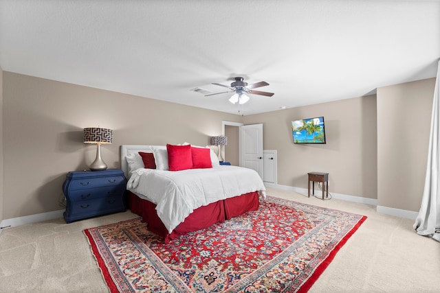 bedroom featuring ceiling fan and light colored carpet