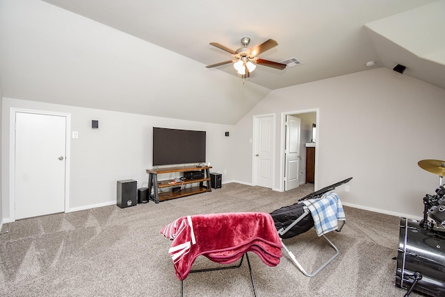 interior space with carpet flooring, a ceiling fan, visible vents, and lofted ceiling