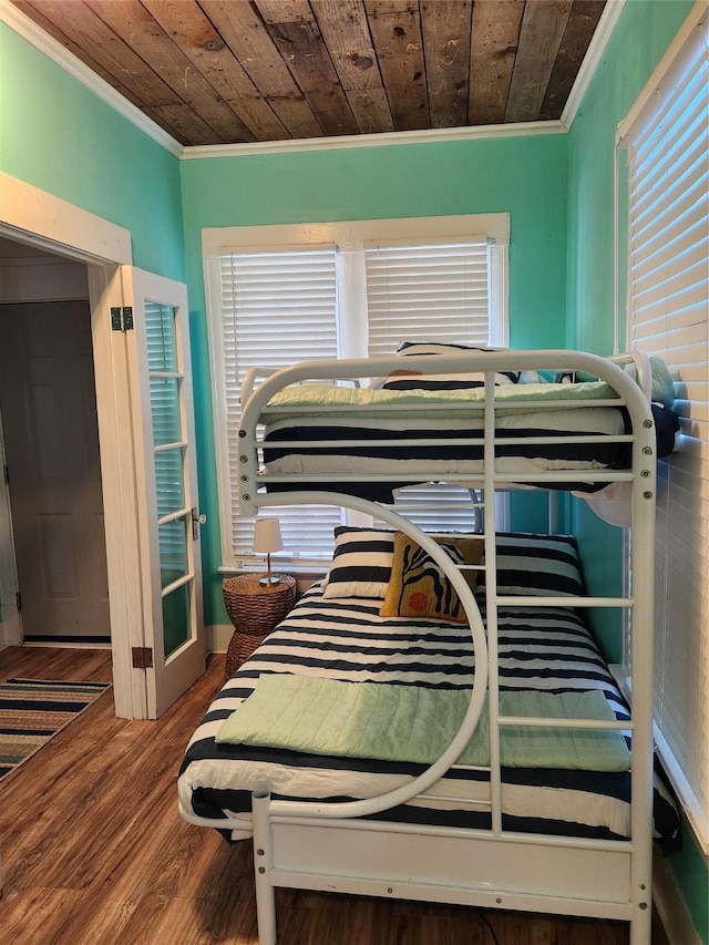 2219 33rd St E, Galveston, TX 77550 - bedroom featuring ornamental molding, wood finished floors, and wooden ceiling