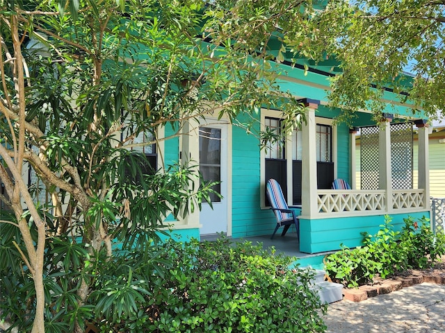 2219 33rd St E, Galveston, TX 77550 - doorway to property featuring a porch