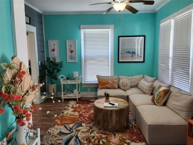 living room featuring crown molding, hardwood / wood-style floors, and ceiling fan