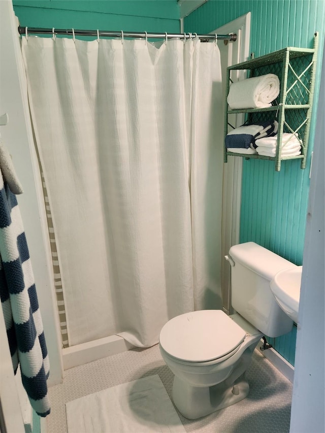 2219 33rd St E, Galveston, TX 77550 - full bathroom featuring toilet and a shower with shower curtain