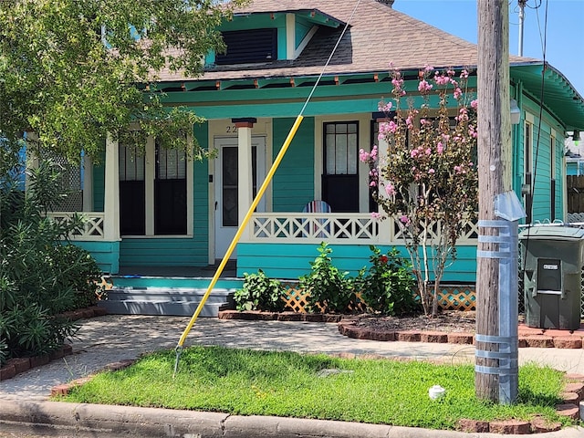 2219 33rd St E, Galveston, TX 77550 - bungalow-style home with a porch and roof with shingles