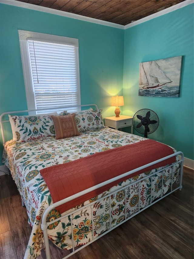 2219 33rd St E, Galveston, TX 77550 - bedroom with crown molding, baseboards, wood finished floors, and wooden ceiling