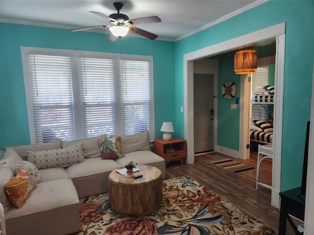 2219 33rd St E, Galveston, TX 77550 - living room with baseboards, a ceiling fan, wood finished floors, and ornamental molding