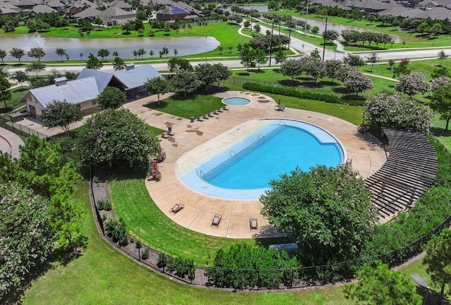 view of swimming pool with a water view