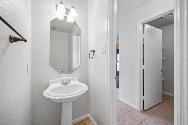 bathroom featuring tile patterned flooring