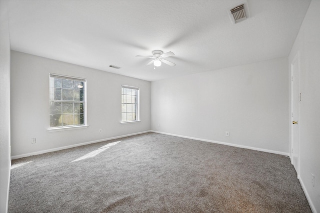 spare room with carpet and ceiling fan