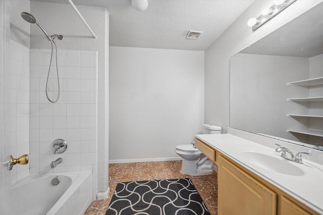 full bathroom with a textured ceiling, vanity, toilet, and tiled shower / bath