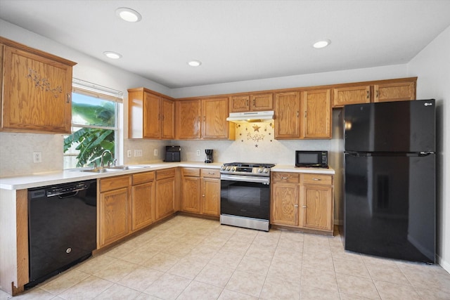 kitchen with tasteful backsplash, sink, and black appliances