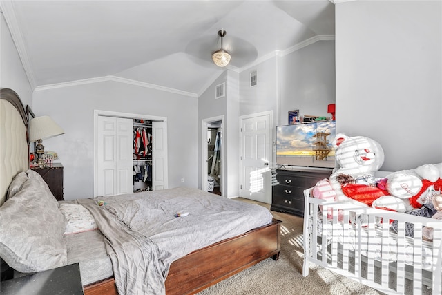 bedroom featuring crown molding, vaulted ceiling, ceiling fan, and a closet