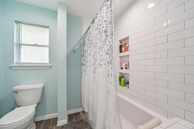 bathroom with toilet, hardwood / wood-style flooring, and shower / bath combination with curtain