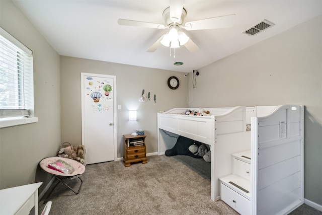 bedroom featuring ceiling fan and light carpet