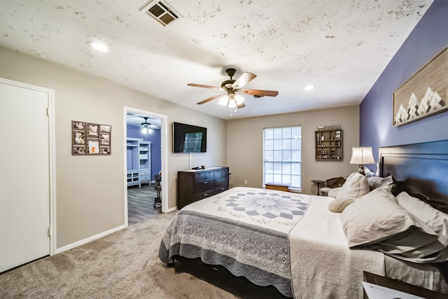 carpeted bedroom with ceiling fan