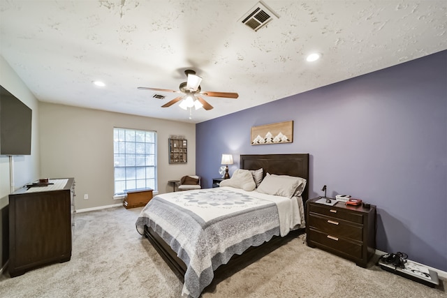 bedroom featuring light carpet and ceiling fan