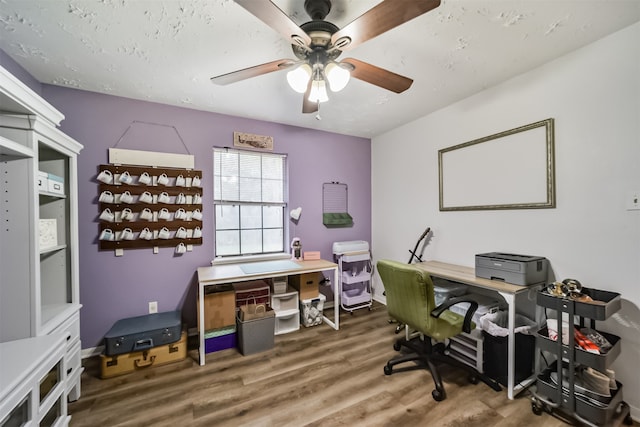 office space with a textured ceiling, hardwood / wood-style floors, and ceiling fan