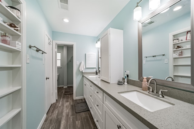 bathroom featuring vanity and hardwood / wood-style floors