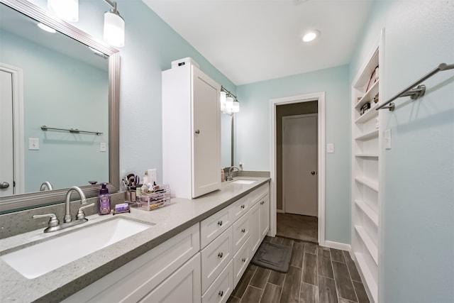 bathroom featuring vanity and hardwood / wood-style flooring