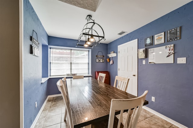 dining space featuring light tile patterned floors