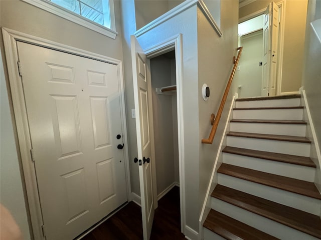 foyer entrance with dark hardwood / wood-style flooring