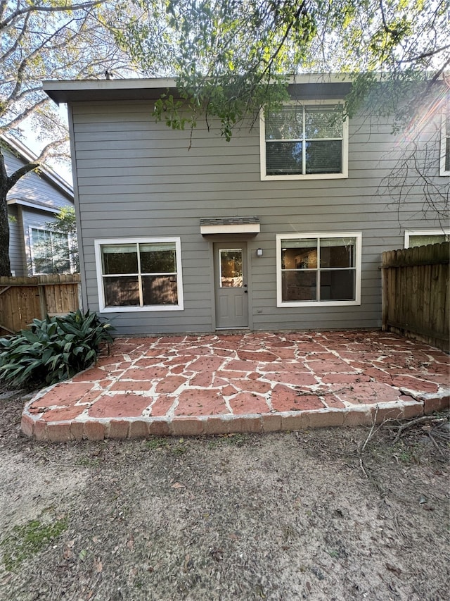 rear view of property featuring a patio area