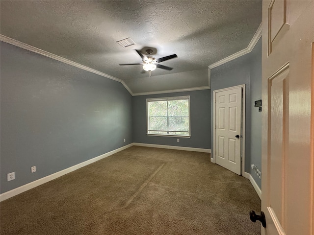 spare room with carpet, a textured ceiling, vaulted ceiling, and ceiling fan