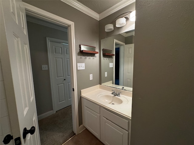 bathroom with vanity and ornamental molding