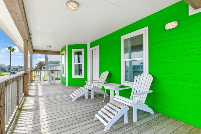 wooden terrace with a porch