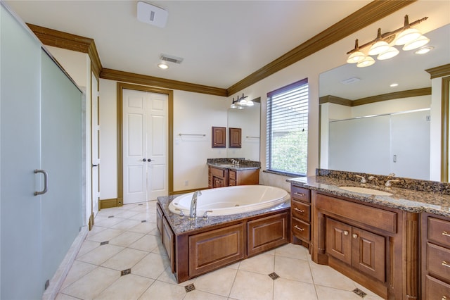 bathroom with tile patterned flooring, independent shower and bath, and vanity