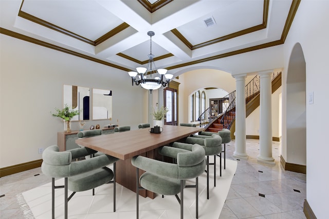 dining area with ornamental molding, coffered ceiling, a notable chandelier, and ornate columns