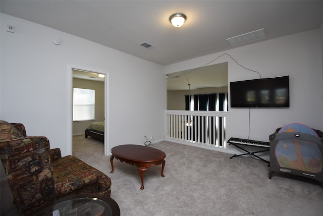 living area with light carpet