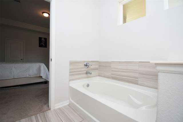 bathroom featuring a washtub