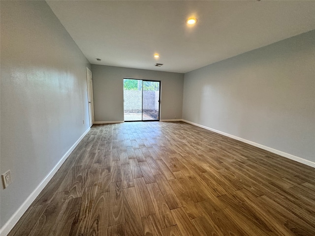 spare room with hardwood / wood-style floors