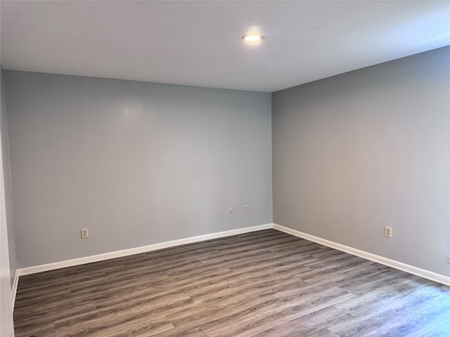 unfurnished room featuring hardwood / wood-style flooring