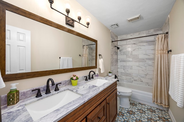 full bathroom with toilet, shower / tub combo with curtain, vanity, and tile patterned flooring