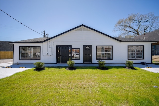 ranch-style house with a front yard