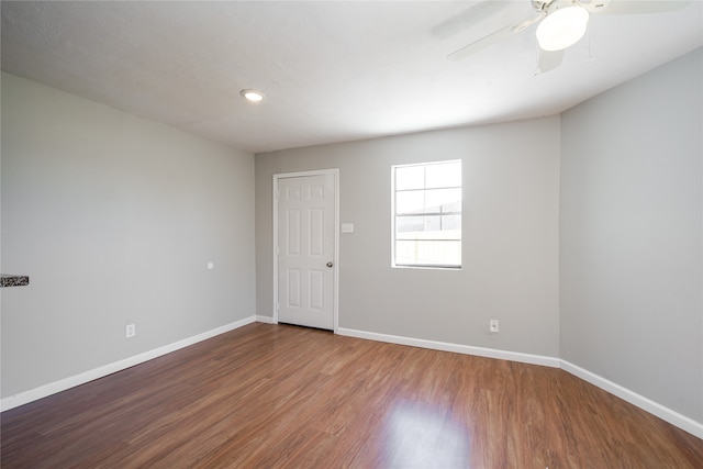 spare room featuring ceiling fan and hardwood / wood-style floors