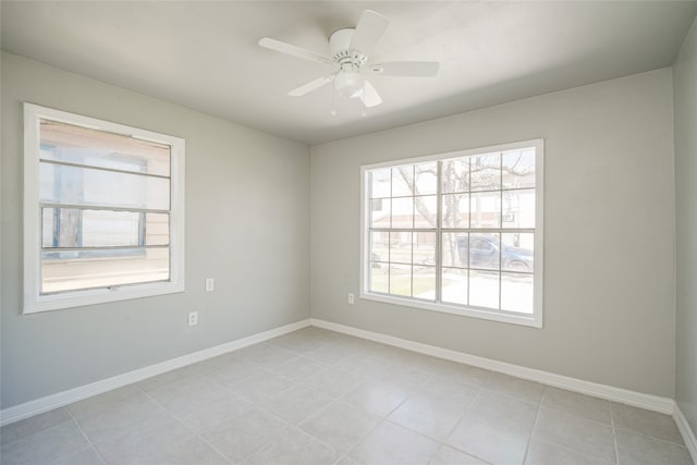 tiled empty room with ceiling fan