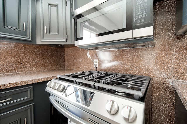 kitchen featuring backsplash and white range oven