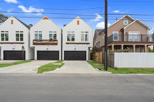 view of front of home with a garage and a balcony