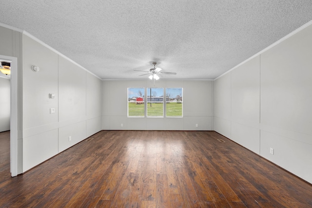 empty room with ornamental molding, dark wood-type flooring, and ceiling fan