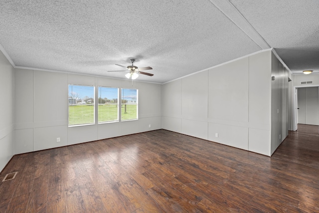 unfurnished room featuring ornamental molding, a textured ceiling, ceiling fan, and dark hardwood / wood-style flooring