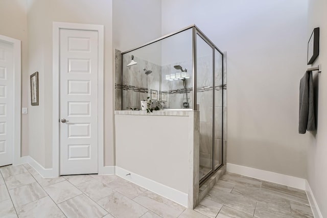 13224 N Salmon River Cir, Humble, TX 77346 - bathroom featuring baseboards and a stall shower