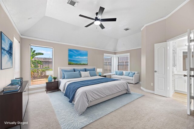 bedroom with connected bathroom, ceiling fan, light colored carpet, and lofted ceiling