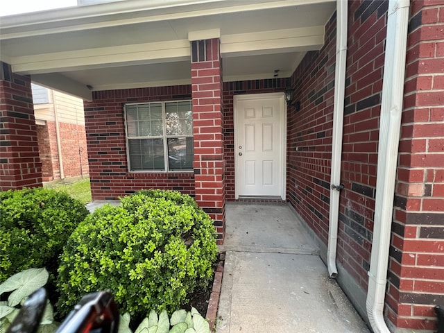 entrance to property with covered porch