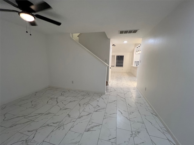 unfurnished room featuring ceiling fan