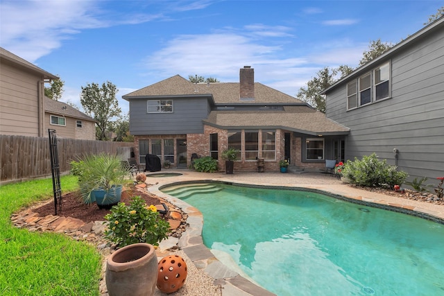 view of pool featuring fence, a fenced in pool, a hot tub, and a patio